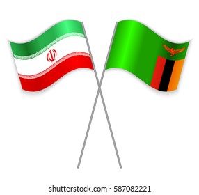 Iranian and Zambian crossed flags. Iran combined with Zambia isolated on white. Language learning, international business or travel concept.