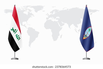 Iraq and Guam flags for official meeting against background of world map.