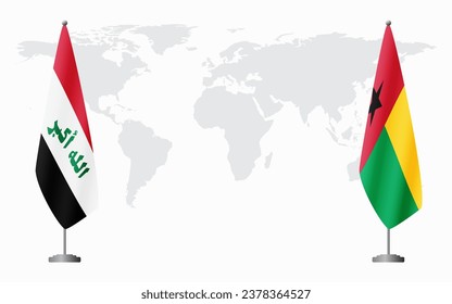 Iraq and Guinea Bissau flags for official meeting against background of world map.