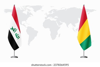 Iraq and Guinea flags for official meeting against background of world map.