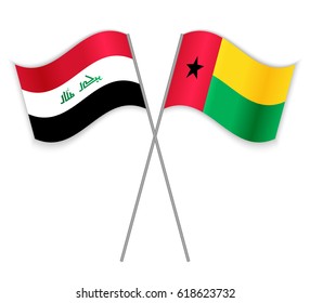 Iraqi and Bissau-Guinean crossed flags. Iraq combined with Guinea-Bissau isolated on white. Language learning, international business or travel concept.