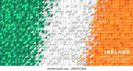 Irland Flagge. Abstrakter Hintergrund kleiner Dreiecke in Form der farbenfrohen, weißen und orangefarbenen Streifen der irischen Flagge. Vektorgrafik.