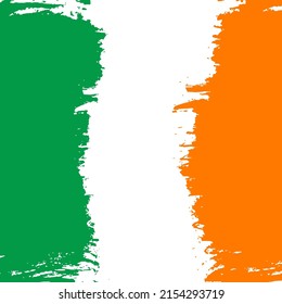 Ireland flag with brush stokes in national colors green, white and orange, abstract background.