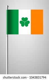 Ireland Flag with Shamrock. National Flag on Flagpole. Isolated Illustration on Gray Background