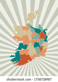 Ireland map. Poster with map of the country in retro color palette. Shape of Ireland with sunburst rays background. Vector illustration.