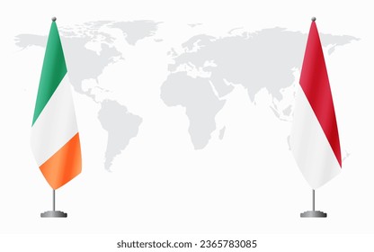 Ireland and Monaco flags for official meeting against background of world map.