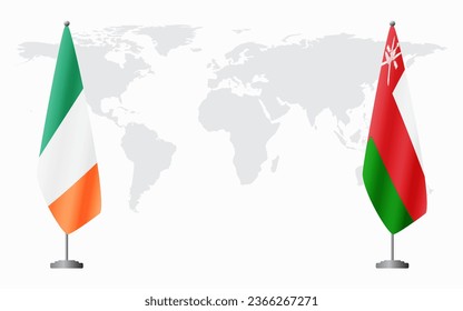 Ireland and Oman flags for official meeting against background of world map.