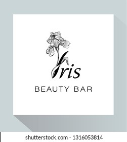 Iris flower logo in the style of engraving. Flower logotype for a spa, wellness center, massage or beauty salon. Beauty logo. Beauty Bar. 