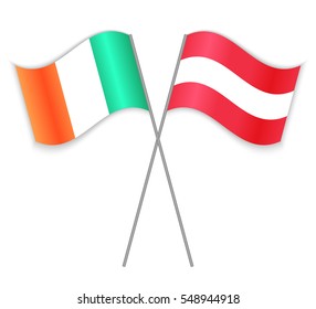 Irish and Austrian crossed flags. Ireland combined with Austria isolated on white. Language learning, international business or travel concept.