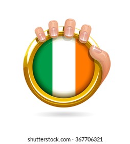Irish Flag Golden Badge Held By Man's Hand