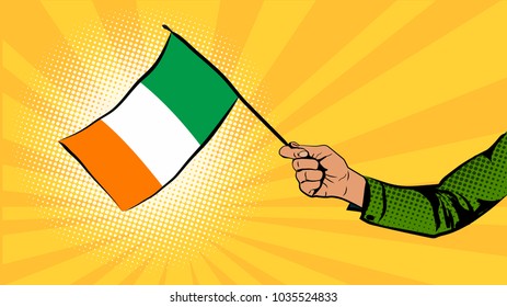 Irish flag in hand. Irish symbols. St.Patrick 's Day