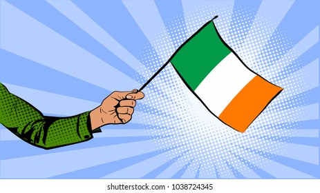 Irish flag in hand. Irish symbols. St.Patrick 's Day