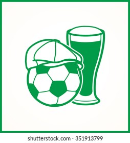 An Irish hat on a soccer ball next to a cold beer
