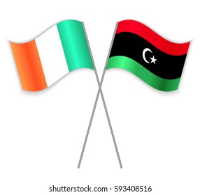 Irish and Libyan crossed flags. Ireland combined with Libya isolated on white. Language learning, international business or travel concept.