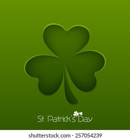 Irish lucky clover leaf on green background for Happy St. Patrick's Day celebration.