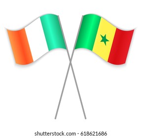 Irish and Senegalese crossed flags. Ireland combined with Senegal isolated on white. Language learning, international business or travel concept.