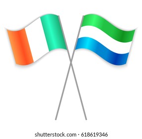 Irish and Sierra Leonean crossed flags. Ireland combined with Sierra Leone isolated on white. Language learning, international business or travel concept.