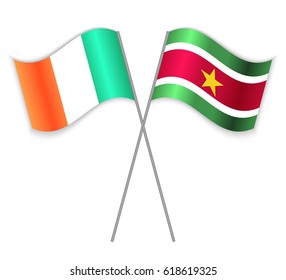 Irish and Surinamese crossed flags. Ireland combined with Suriname isolated on white. Language learning, international business or travel concept.