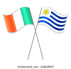 Irish and Uruguayan crossed flags. Ireland combined with Uruguay isolated on white. Language learning, international business or travel concept.
