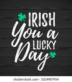 Irish You a Lucky Day handdrawn dry brush style lettering on black wooden background, 17 March St. Patrick's Day celebration. Suitable for greeting card design, poster, etc., vector illustration