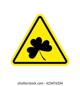 Irishman Warning. Clover on yellow triangle. Road sign attention shamrock