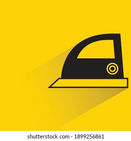 iron with drop shadow on yellow background