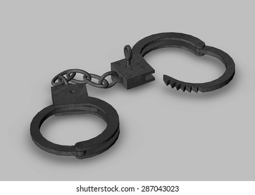 Iron handcuffs opened with a key close-up on a grey background isolated