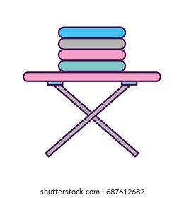 ironing board with pile of clothes