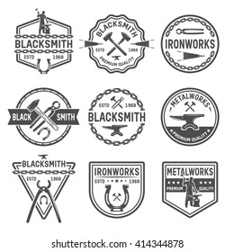 Ironworks black white emblems with working tools blacksmith horseshoe chain and inscriptions isolated vector illustration