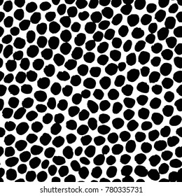 Irregular black dots pattern. Seamless hand drawn graphic print. Chaotic vector illustration