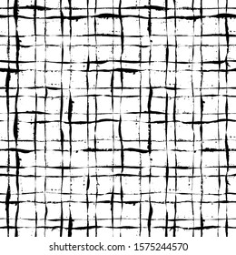 Irregular Plaid Pattern. Seamless hand drawn background. Trendy tartan print. Black and white grunge checkered illustration. Brush strokes painted texture.