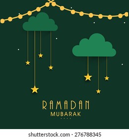 Islamic holy month of prayers, Ramadan Mubarak celebrations concept with hanging golden stars on green background. 