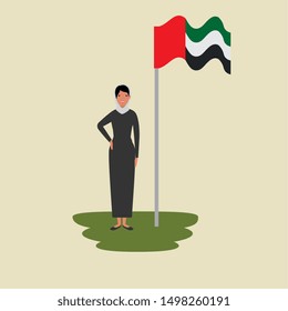 islamic woman with traditional burka and arabia flag in pole