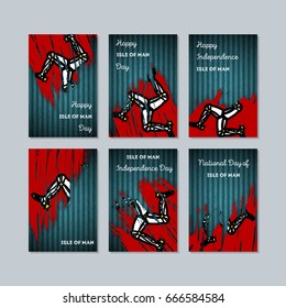 Isle of Man Patriotic Cards for National Day. Expressive Brush Stroke in Flag Colors on dark striped background. Vector Greeting Card.