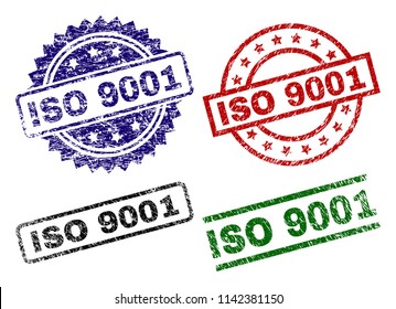 ISO 9001 seal prints with corroded texture. Black, green,red,blue vector rubber prints of ISO 9001 caption with corroded texture. Rubber seals with circle, rectangle, medal shapes.