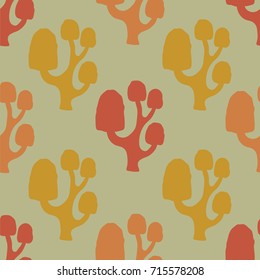 isolate vector autumn silhouette seamless doodle colorful orange,red,gold.yellow trees pattern on green background