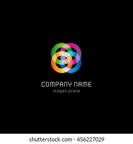 Isolated abstract colorful connected circles vector logo. Rings on the black background logotype. Geometric shape icon. Wheels and hoops illustration.