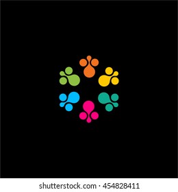 Isolated abstract colorful flower vector logo. Round shape sun illustration on the black background. Animal footsteps logotype. Cartoon icon.