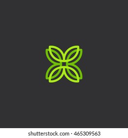 Isolated abstract  green color flower petals vector logo on the black background. Cross logotype. Leaves illustration. Plant element. Natural products icon. 