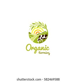Isolated abstract round shape rural landscape with sun, green meadow and cow logo, organic farming logotype vector illustration