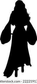Isolated black silhouette of a witch with long gown holding a 
 wand and a book