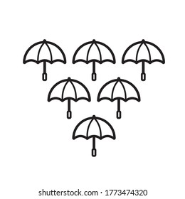 isolated black and white umbrellas forming a triangle 