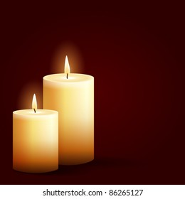 isolated burning candles on dark red background