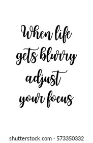 Isolated calligraphy on white background. Quote about photo and photography. When life gets blurry adjust your focus.