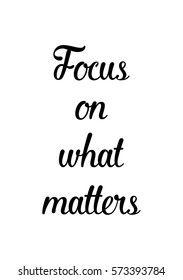 Isolated calligraphy on white background. Quote about photo and photography. Focus on what matters.