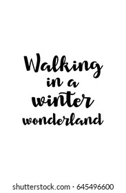Isolated calligraphy on white background. Quote about winter and Christmas. Walking in a winter wonderland.