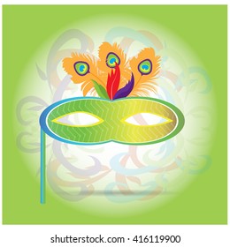 Isolated carnival mask with feathers on a light green background