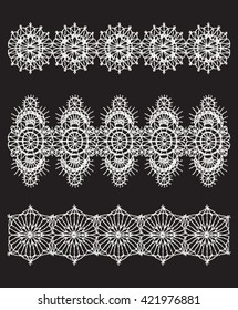 Isolated crocheted lace border with an openwork pattern.