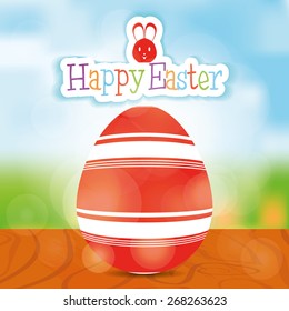 Isolated easter egg with texture and text on a landscape. Vector illustration