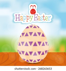Isolated easter egg with texture and text on a landscape. Vector illustration